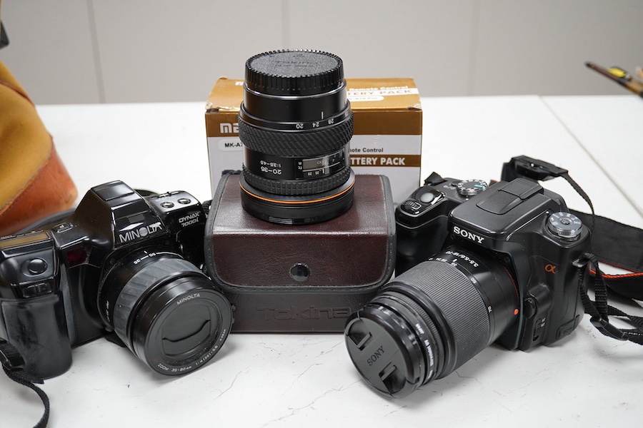 A quantity of photographic equipment to include Tokina AF 20-35 lens, Sigma 135-400 lens, Minolta Dynax 7000i; camera, lens and flash, Sony A100 digital camera with a Sony 18-70mm lens, a Voightlander 15mm view finder, t